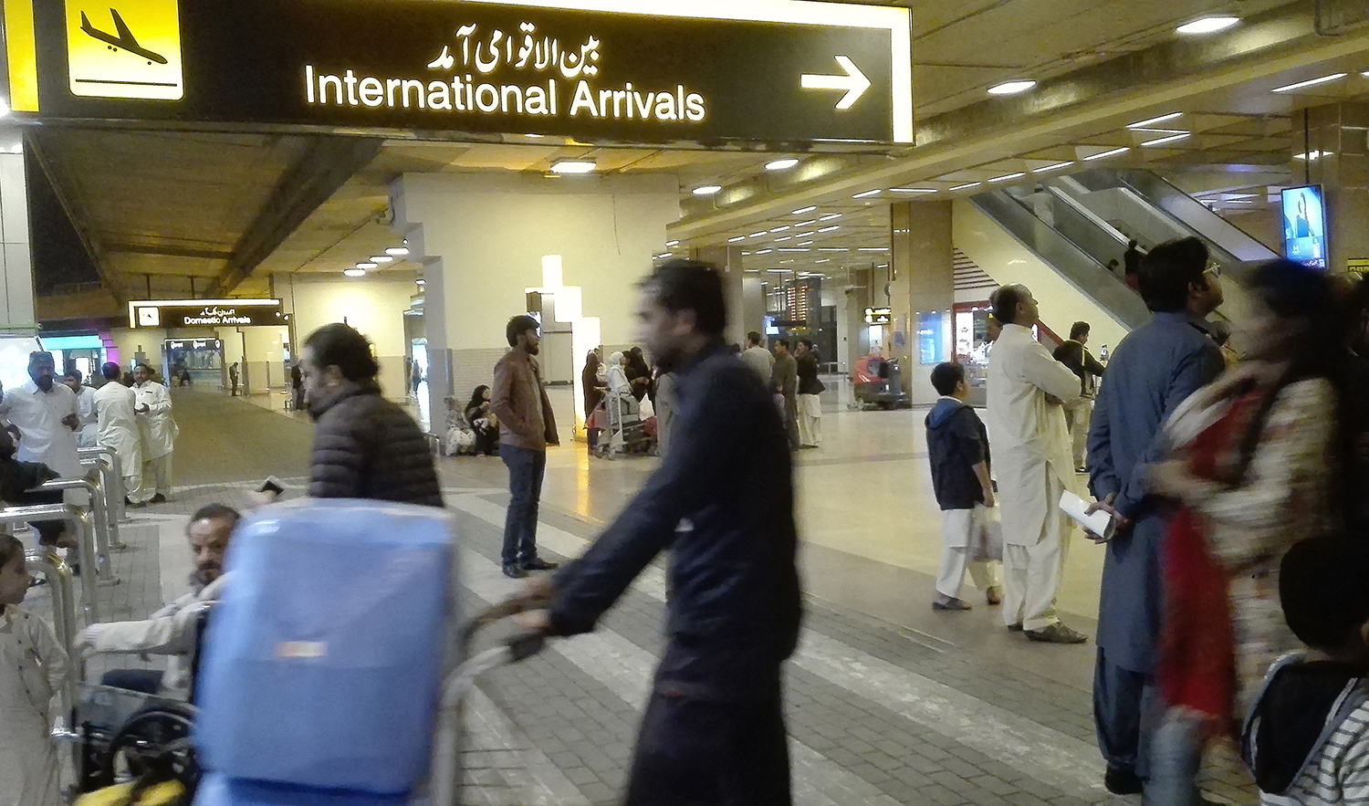 Passengers walk after their arrival at the Jinnah International Airport in Karachi, Pakistan on January 31, 2020. (AFP/File)