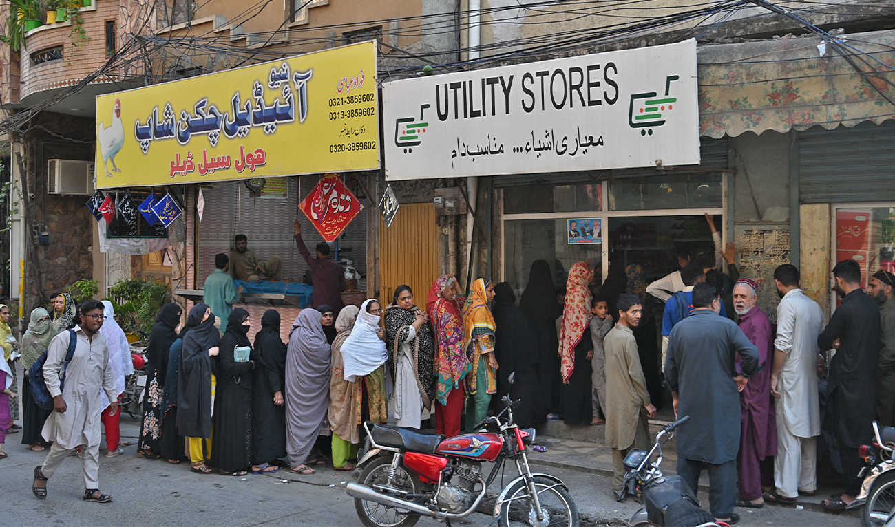 Residents lineup to buy groceries at government rates outside a store in Rawalpindi on May 3, 2023. (AFP/File)