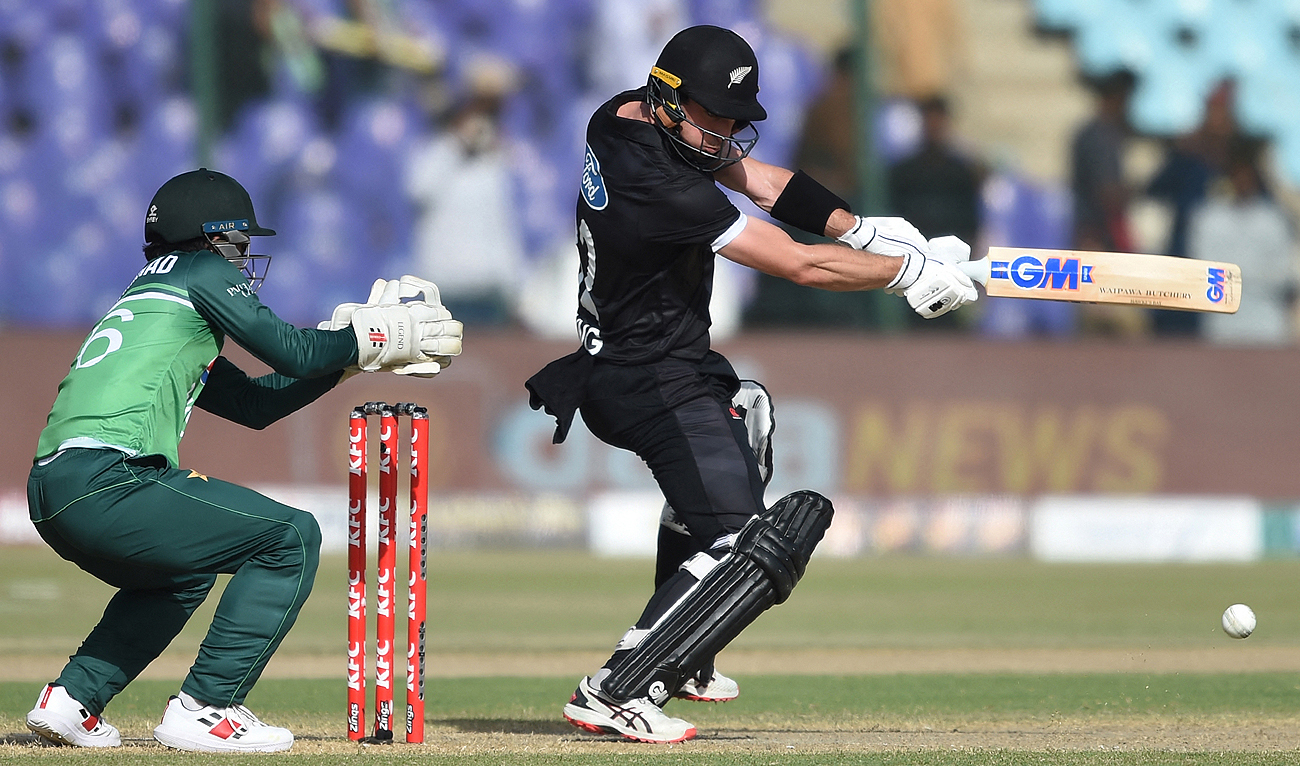 New Zealand's Will Young (R) plays a shot during the fifth and final One-Day International (ODI) cricket match between Pakistan and New Zealand at the National Stadium in Karachi on May 7, 2023. (Photo courtesy: AFP)