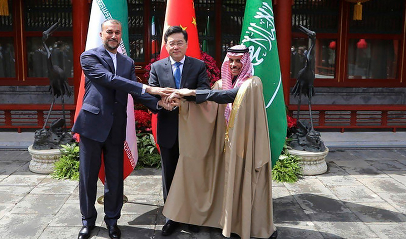 Saudi Arabia’s foreign minister Prince Faisal bin Farhan Al-Saud (right), shakes hand with his Iranian counterpart Hossein Amirabdollahian(left), and Chinese counterpart Qin Gang in Beijing on Thursday, April 6, 2023. (Photo courtesy: Iranian foreign ministry via AFP)