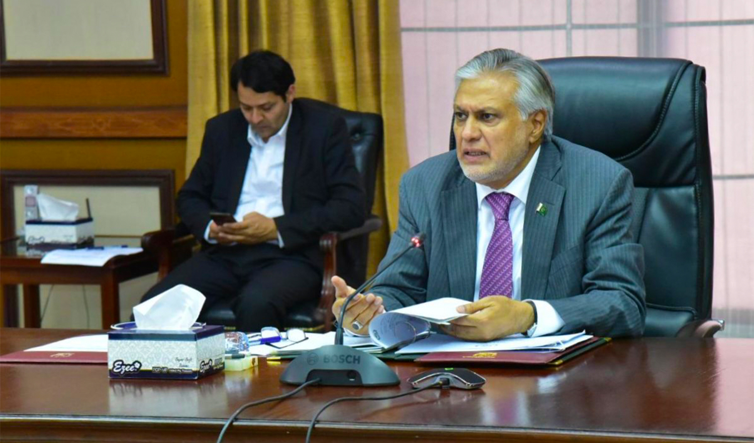 The file photo shared on the Pakistani Finance Ministry's Twitter account on March 14, 2023, shows Minister Ishaq Dar chairing an Economic Coordination Committee meeting. (@FinMinistryPak/Twitter)