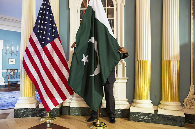 A State Department contractor adjusts Pakistan national flag before a meeting at the State Department in Washington on February 19, 2015. (REUTERS/File)