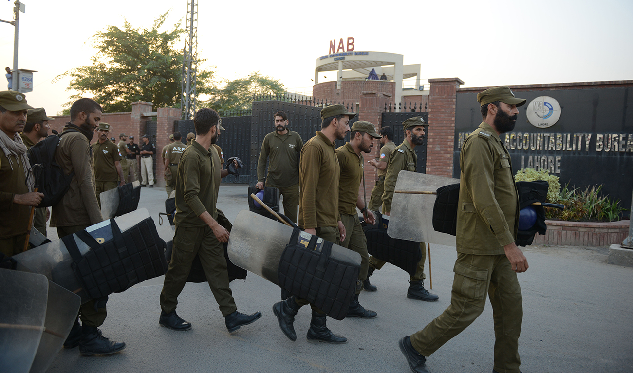 Pakistan policemen patrol outside the office of National Accountability Bureau in Lahore on October 5, 2018. (AFP/File)