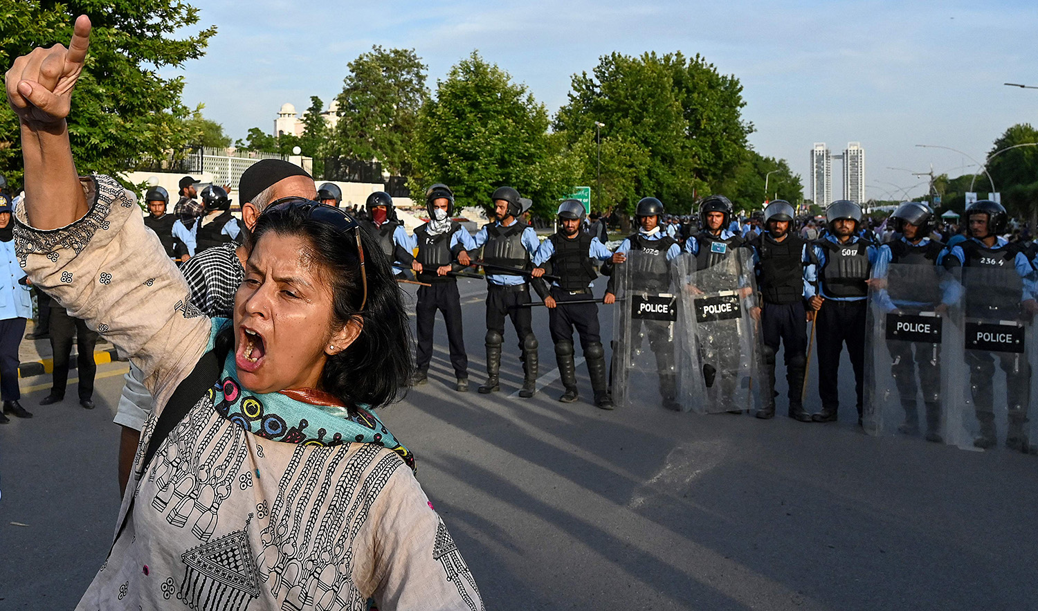 A Pakistan Tehreek-e-Insaf (PTI) party activist and supporter of Pakistan's former Prime Minister Imran Khan chants slogan during Khan's hearing at the Supreme Court in Islamabad on May 11, 2023. (AFP)