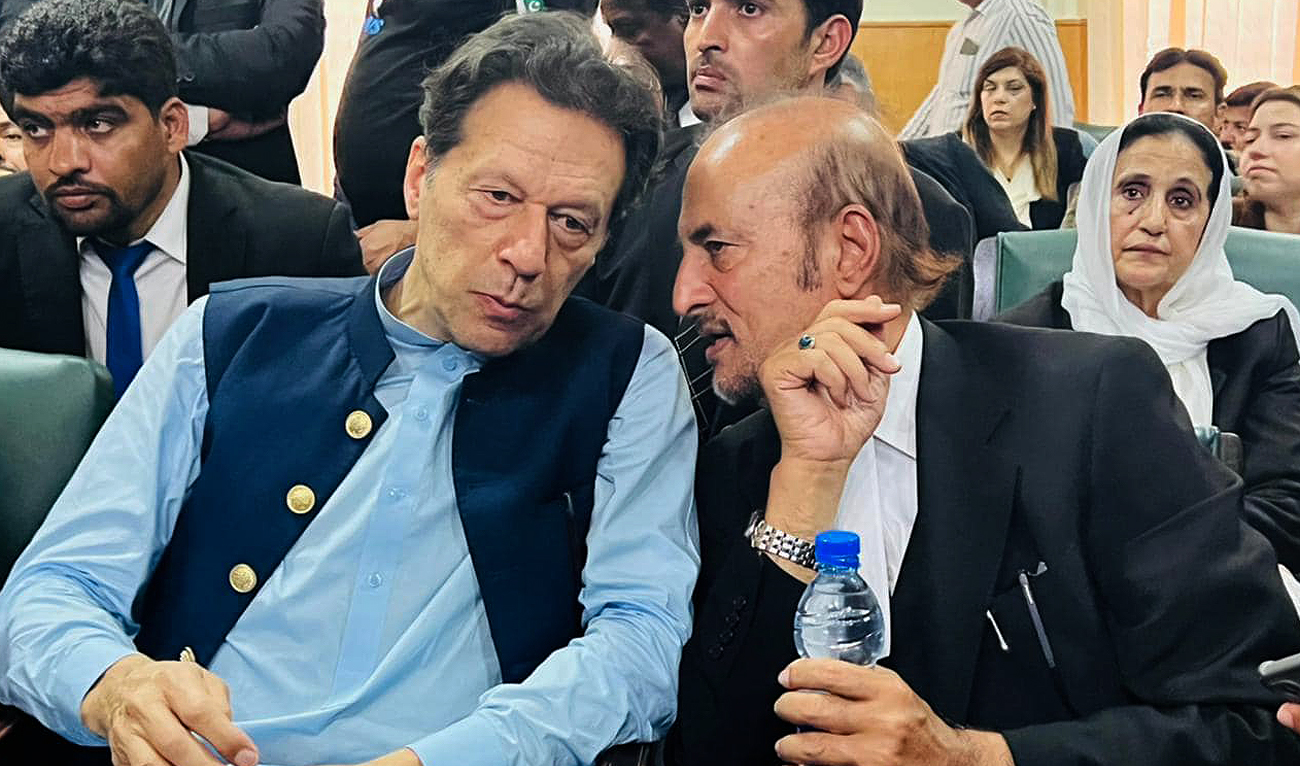 Pakistan's former prime minister Imran Khan (left) gestures with his senior counsel, Babar Awan (right) during his court presence in the Islamabad High Court on May 12, 2023. (Photo courtesy: Facebook/BabarAwanPK)