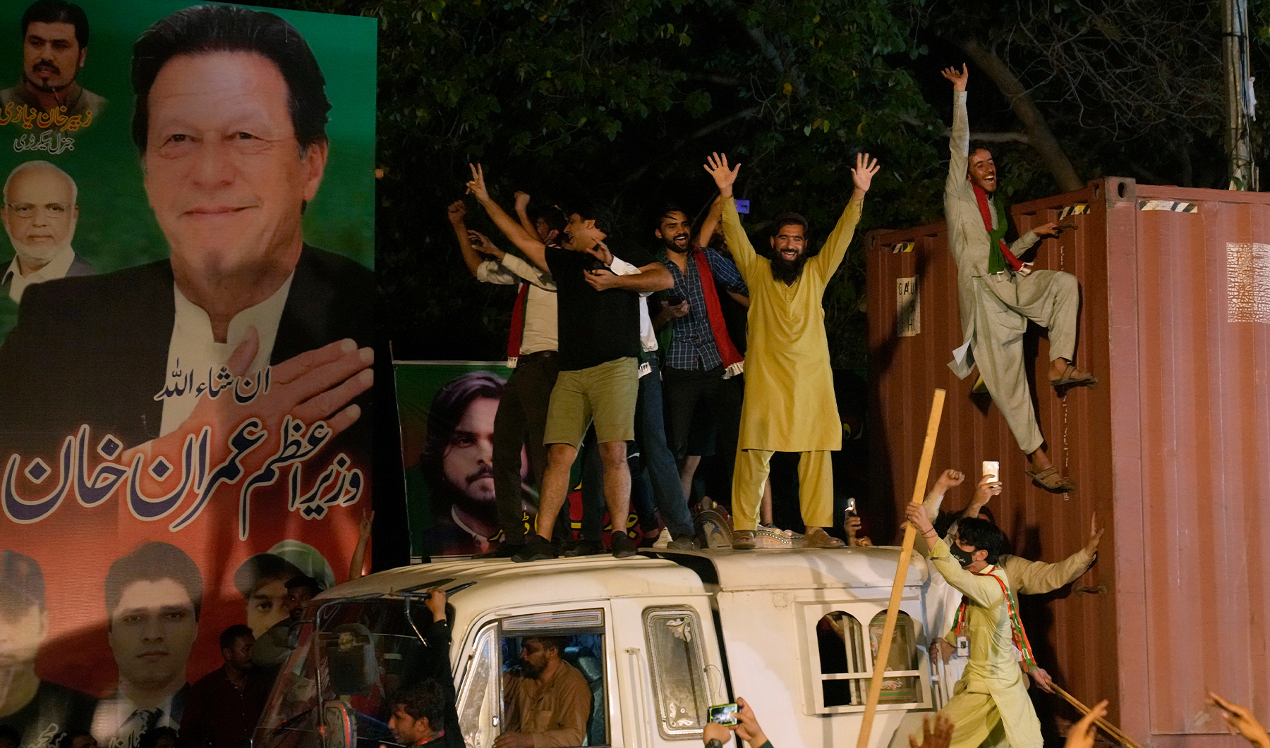 Supporters of former Prime Minister Imran Khan greet their leader upon is arrival at his home in Lahore, Pakistan, on May 13, 2023. (AP)