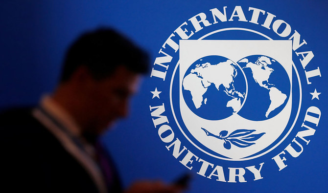 A participant stands near a logo of IMF at the International Monetary Fund - World Bank Annual Meeting 2018 in Nusa Dua, Bali, Indonesia, on October 12, 2018. (REUTERS/File)