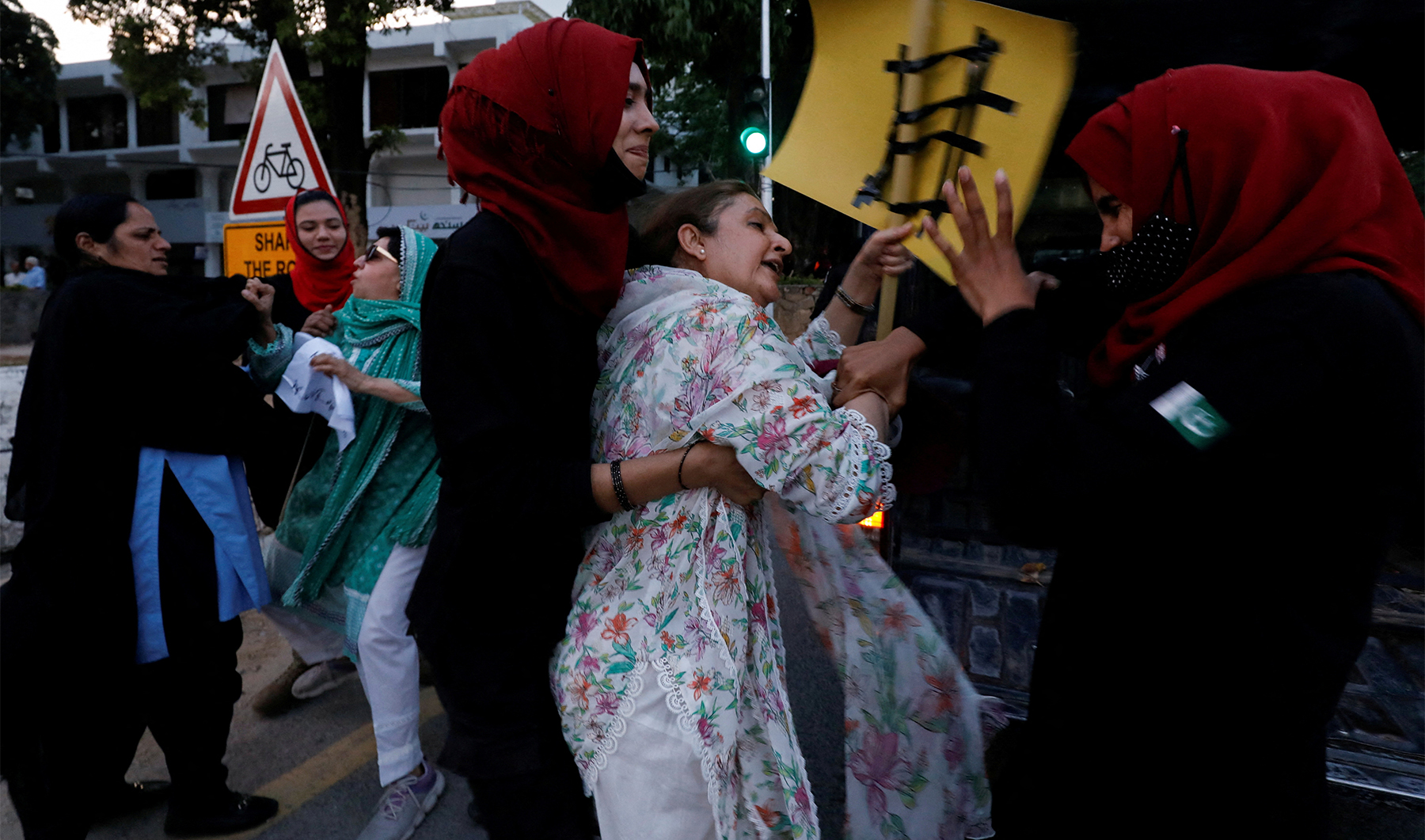 Police officers detain female supporters of Pakistan's former Prime Minister Imran Khan, as they gather for what they call 'a true freedom protest', demanding 'Save Constitution - Save Pakistan', in Islamabad, Pakistan, on May 14, 2023 (REUTERS)