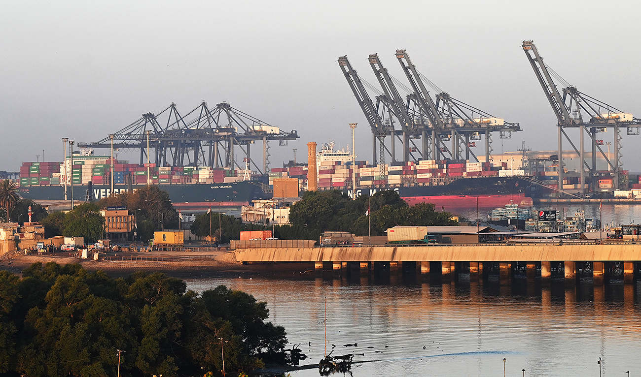Shipping containers are seen stacked on a ship at a sea port in Karachi on April 6, 2023. (AFP/File)