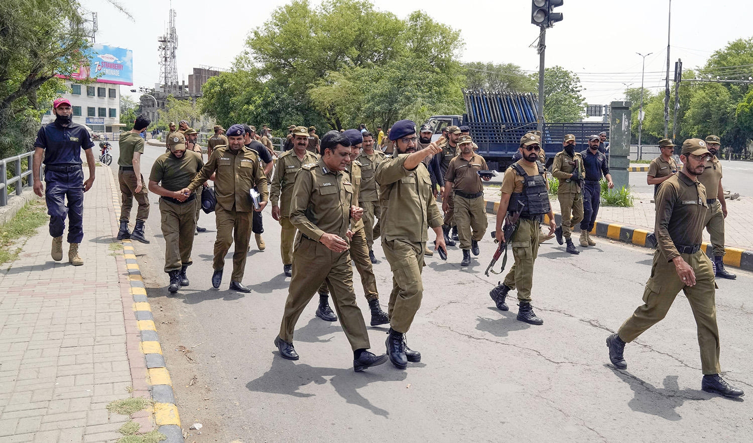 Police officers patrol around the residence of Pakistan's former Prime Minister Imran Khan, in Lahore, Pakistan, on May 18, 2023. (AP)