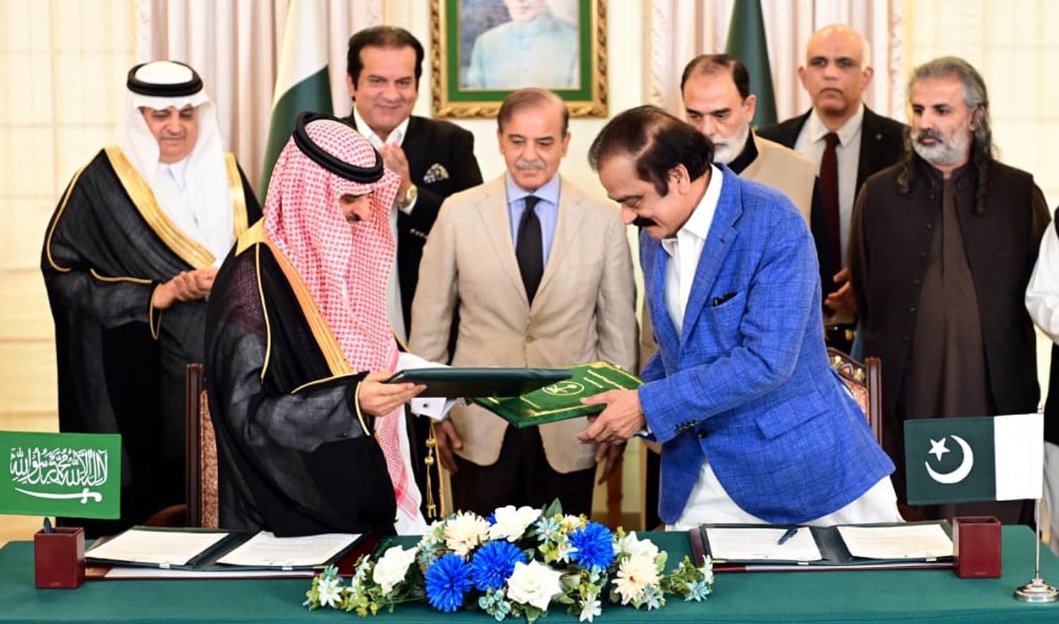 Saudi Deputy Interior Minister Dr. Nasser bin Abdul Aziz Al-Dawood and Pakistan's Interior Minister Rana Sanaullah exchanging documents after signing the Memorandum of Understanding regarding the Road to Makkah project in Islamabad on May 17, 2023. (PID)