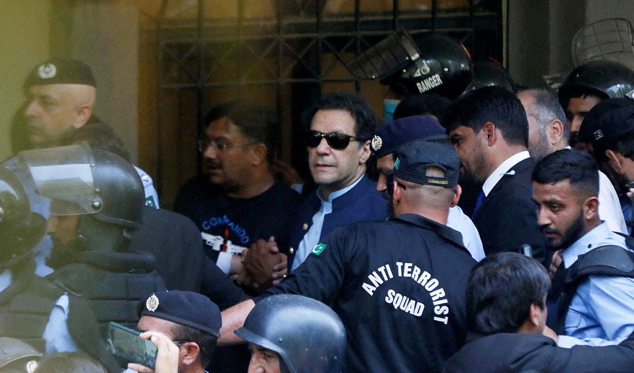 Security officers escort Pakistan's former Prime Minister Imran Khan, as he appeared in Islamabad High Court, Islamabad, Pakistan May 12, 2023. (REUTERS)