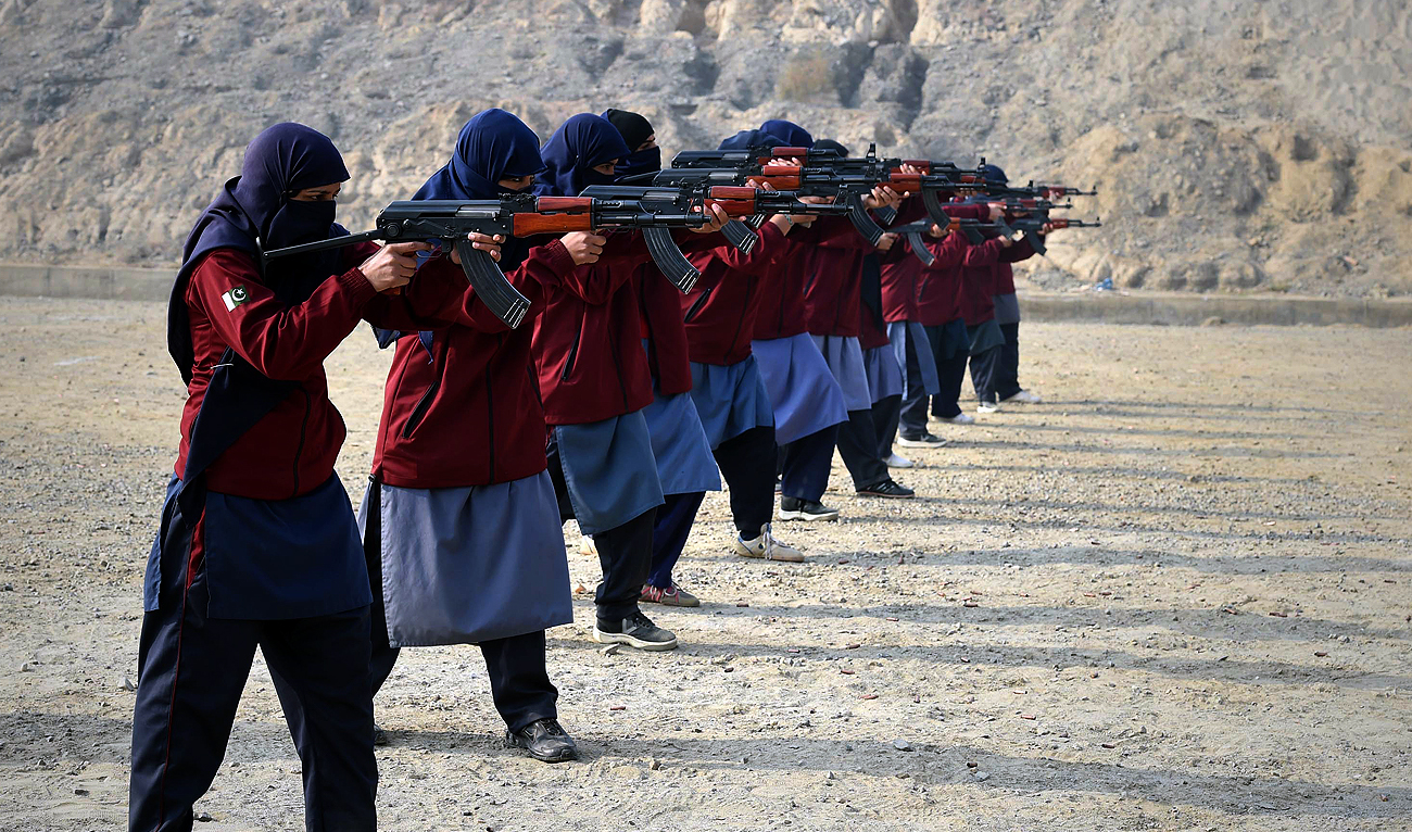 This photograph taken on December 16, 2014 shows female Pakistani police commandos aiming their assault rifles during a demonstration of their skills at a police training centre in Nowshera, a district in the Khyber Pakhtunkhwa Province. (Photo courtesy: AFP/File)