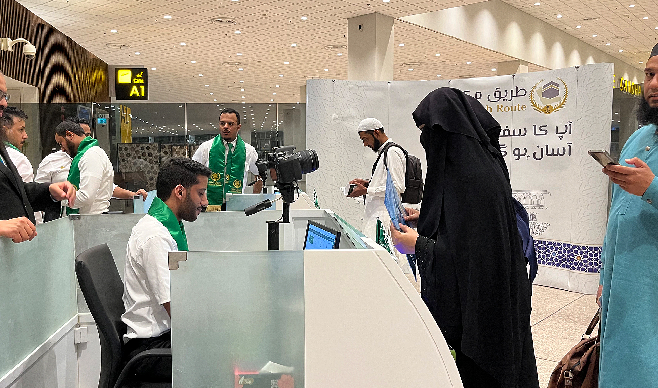 In this picture, taken on May 21, 2023, Pakistani Hajj pilgrims check in for their flight to Madina through Makkah Route initiative at the Islamabad International Airport in Islamabad. (AN Photo by Fatimah Amjad)