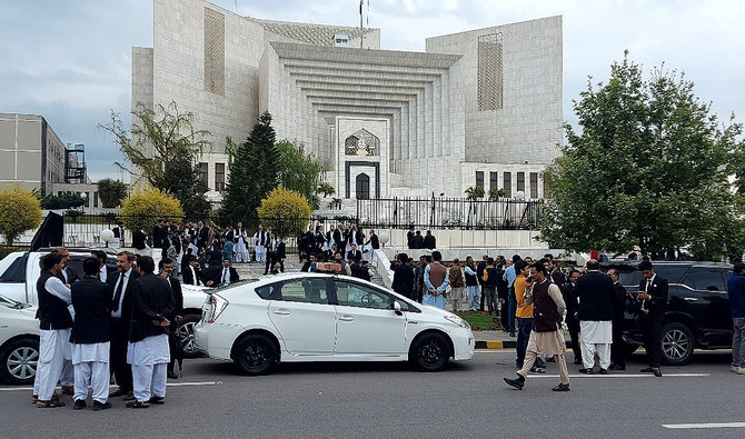 In this picture, taken on April 3, 2023, Pakistani lawyers gather outside the Supreme Court during the hearing of a case related to the postponement of Punjab polls in Islamabad. (AN Photo)