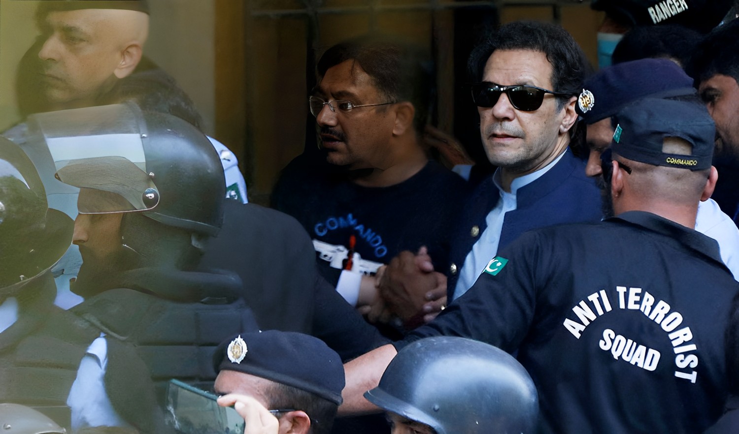 Security officers escort Pakistan's former Prime Minister Imran Khan, as he appeared in Islamabad High Court, Islamabad, Pakistan on May 12, 2023. (REUTERS)