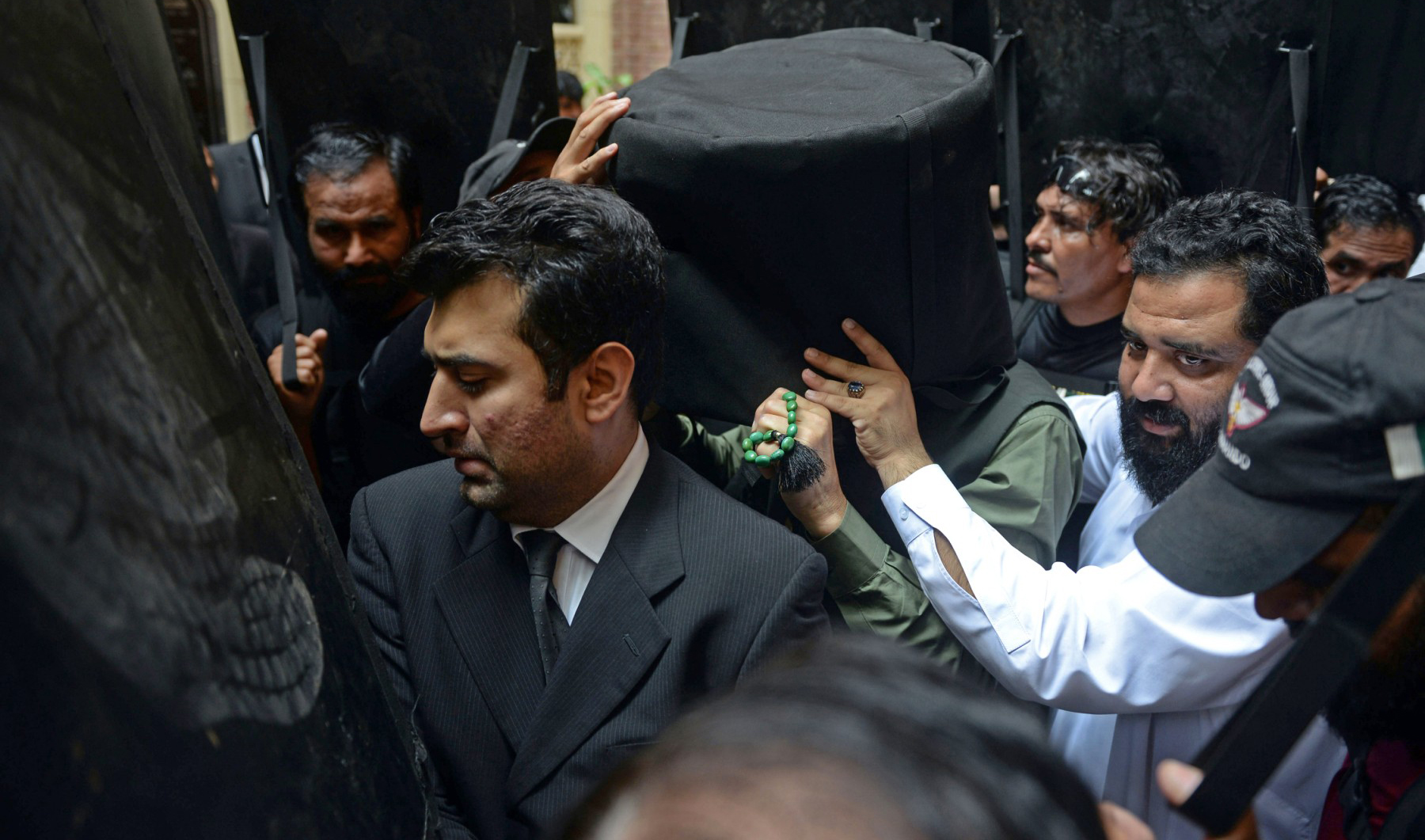 Security personnel with ballistic shields escort former Pakistan's prime minister Imran Khan (C) to the High Court in Lahore, Pakistan, on May 30, 2023. (AFP)