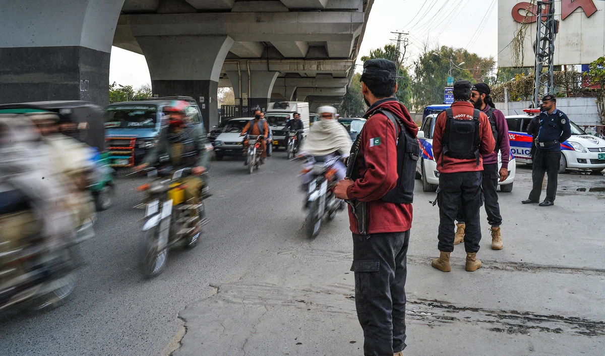 Policemen stand guard along a street a day after a mosque suicide blast inside a police headquarters in Peshawar, Pakistan on February 1, 2023. (AFP/File)