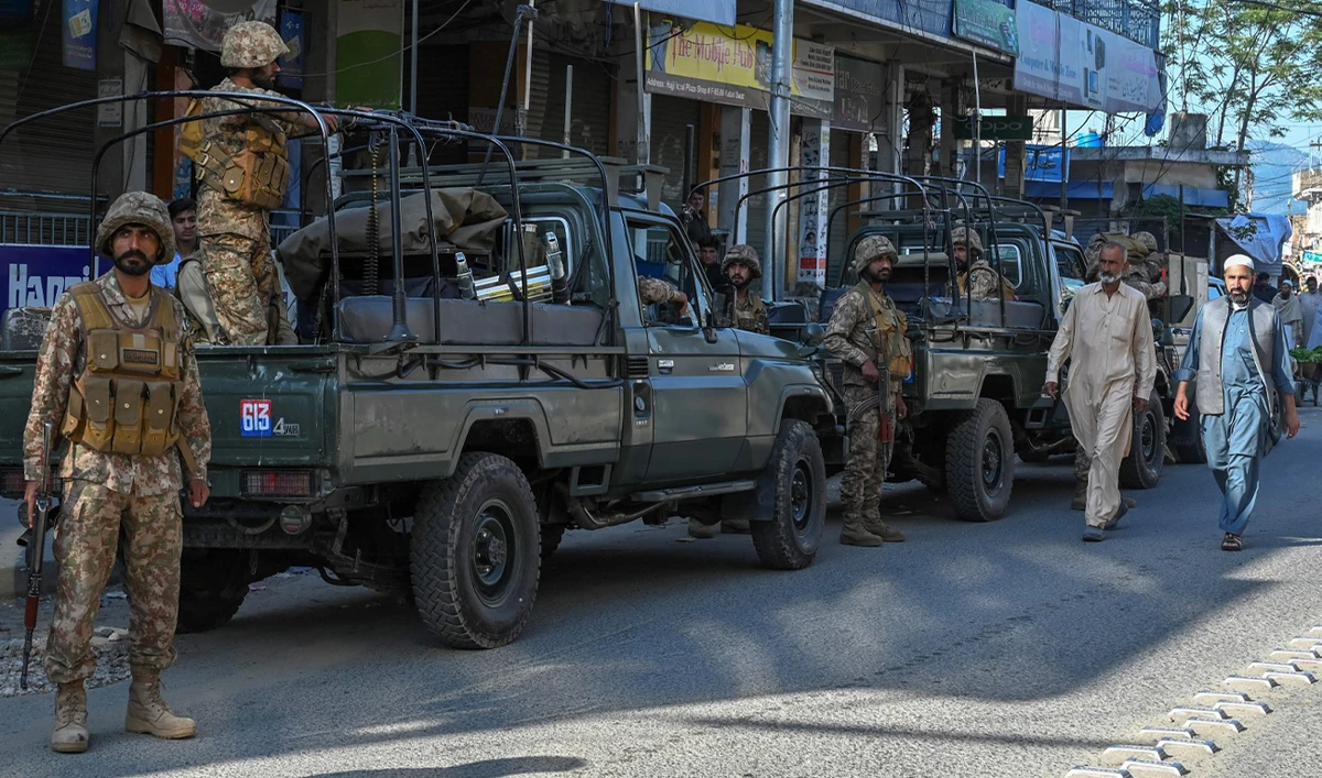Army troops stand stand guard along a street in Kabal town of Swat Valley in Pakistan’s northwestern region of Khyber Pakhtunkhwa province on April 25, 2023. (AFP/File)