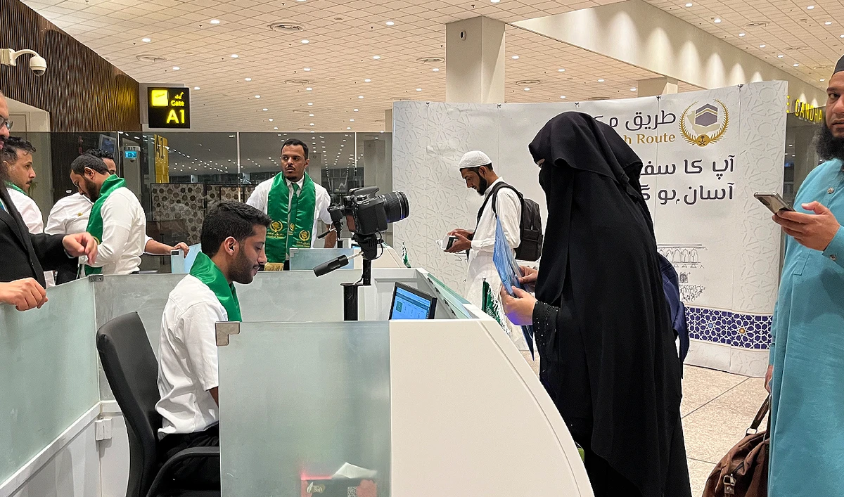 In this picture, taken on May 21, 2023, Pakistani Hajj pilgrims check in for their flight to Madina through Makkah Route initiative at the Islamabad International Airport in Islamabad. (AN Photo by Fatimah Amjad)