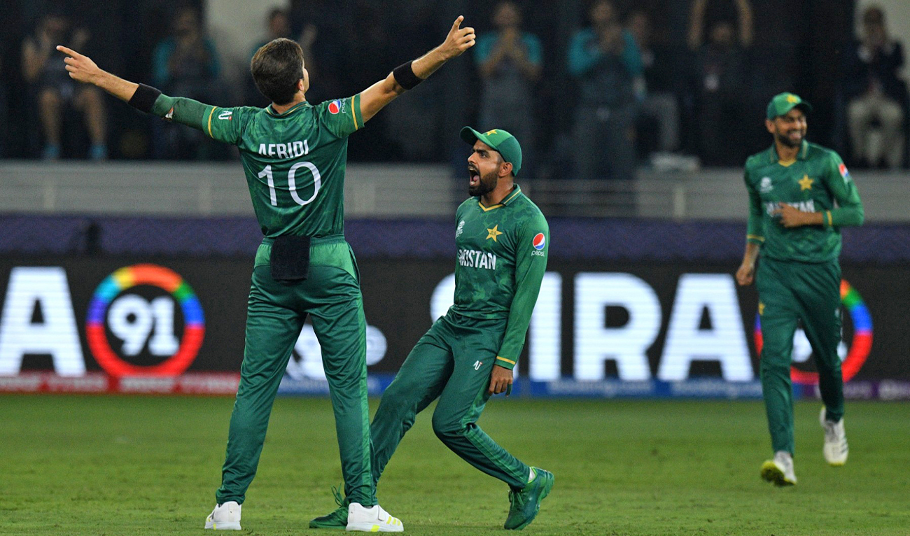 Pakistan's Shaheen Shah Afridi (L) celebrates with his captain Babar Azam (C) after taking the wicket of India's KL Rahul (not pictured) during the ICC men’s Twenty20 World Cup cricket match between India and Pakistan at the Dubai International Cricket Stadium in Dubai on October 24, 2021. (AFP/File)