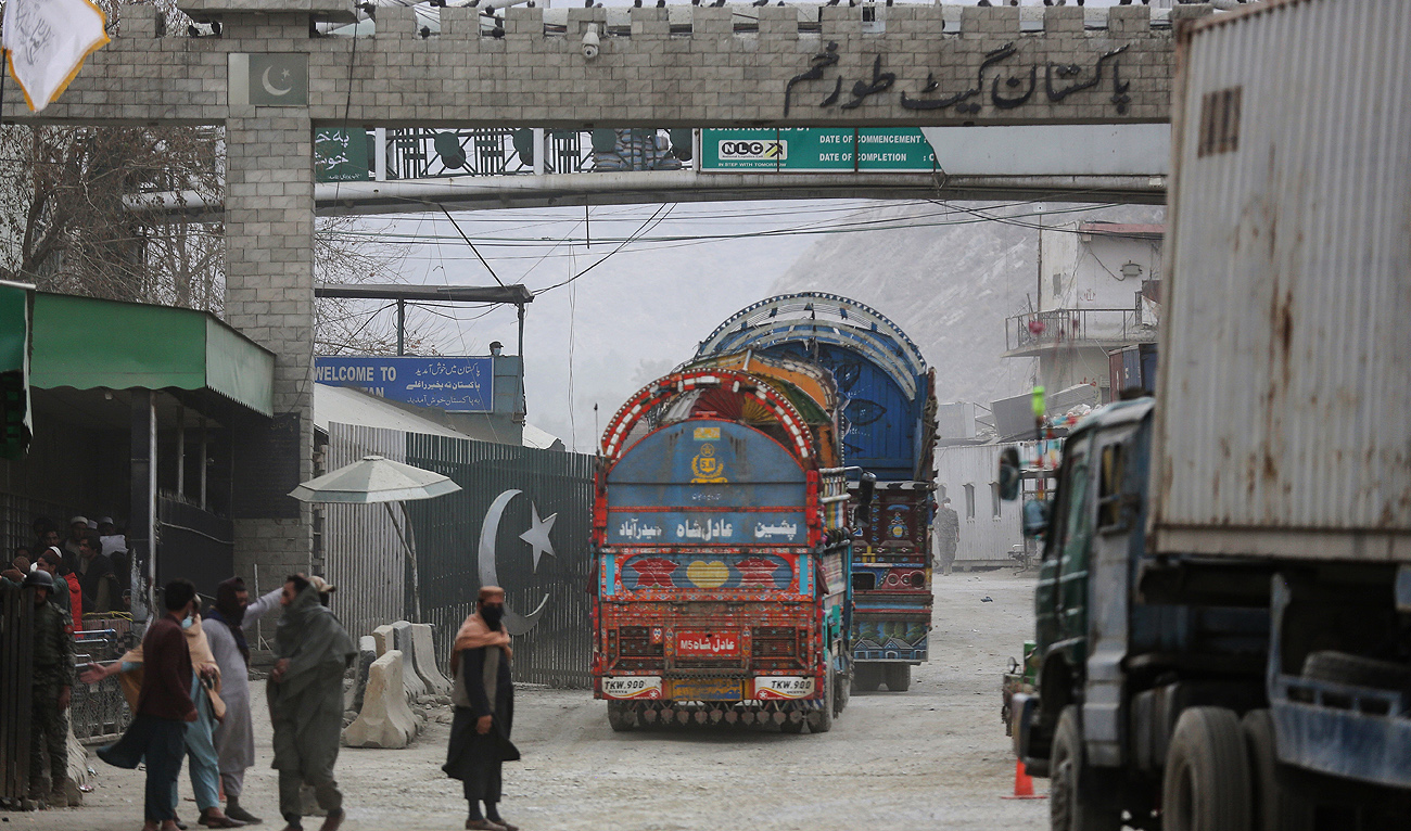 Goods carrier trucks cross into Pakistan at the zero point Torkham border crossing between Afghanistan and Pakistan, in Nangarhar province on February 25, 2023. (Photo courtesy: AFP/File)