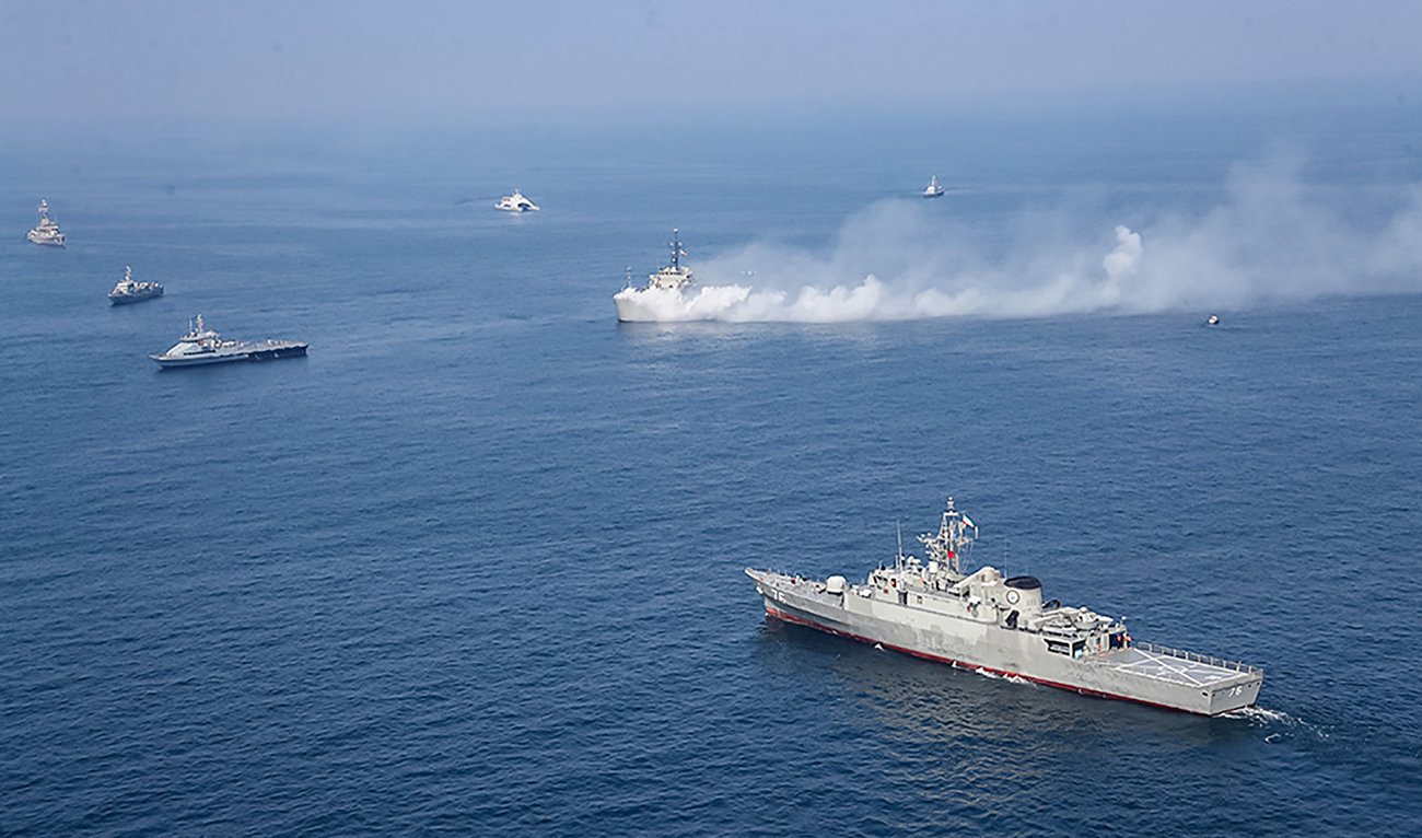 A handout photo made available by the Iranian Army office on February 16, 2021, shows the Iranian navy frigate Jamaran (76, bottom) taking part in a joint naval drill in the northern Indian Ocean. (Photo courtesy: AFP/File)