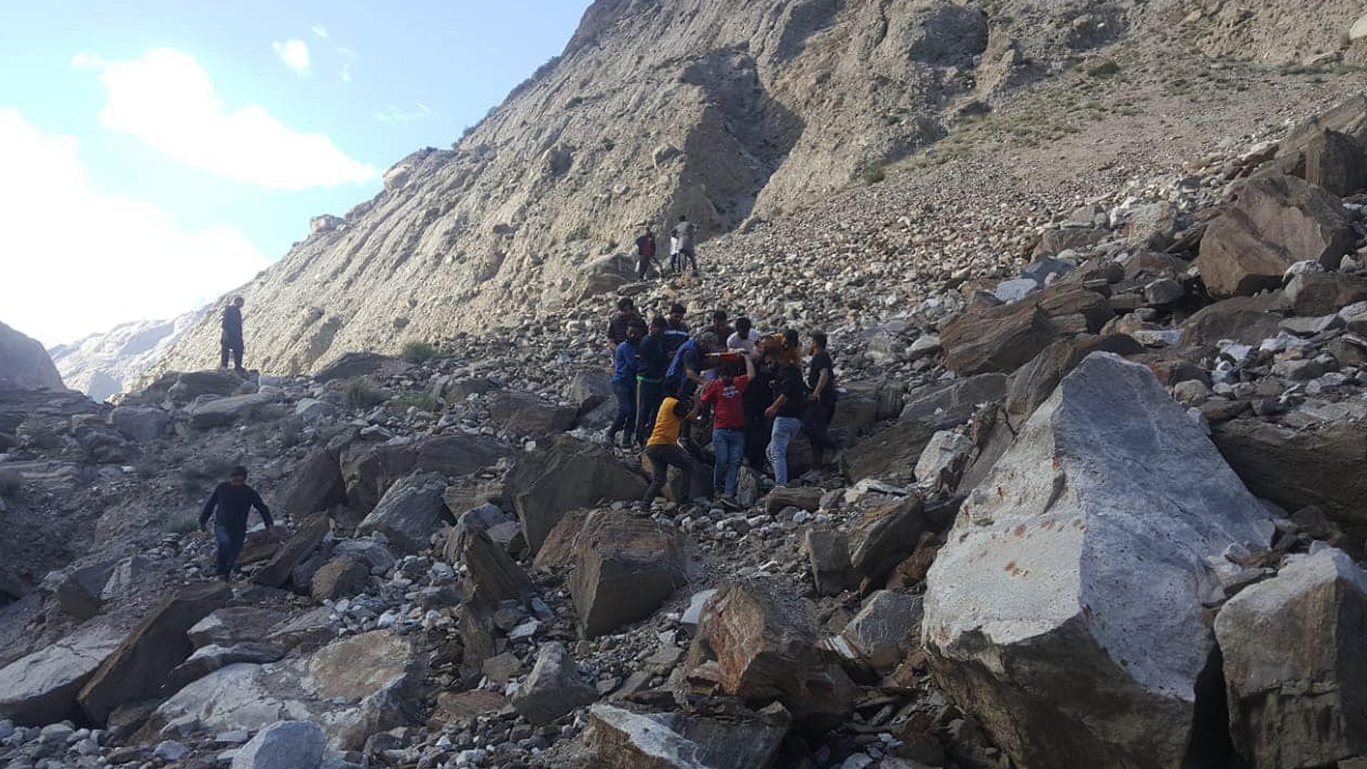 Volunteers carry the bodies of victims after a landslide kills two in Pakistan’s northern Hunza district on June 2, 2023. (Photo courtesy: Twitter/pamirtimes)