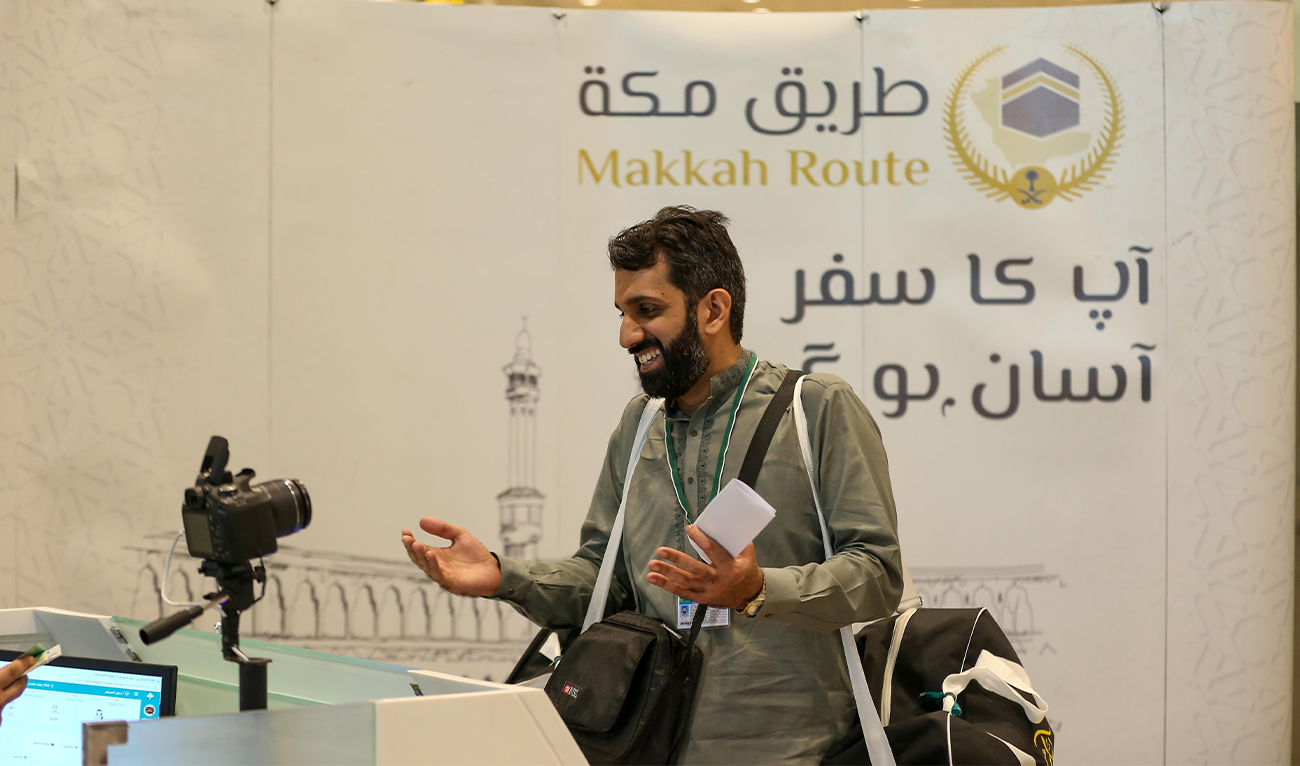 The picture posted on June 7, 2023 shows a Pakistani pilgrim at the immigration counter under Route to Makkah initiative at Islamabad International Airport. (SPA)