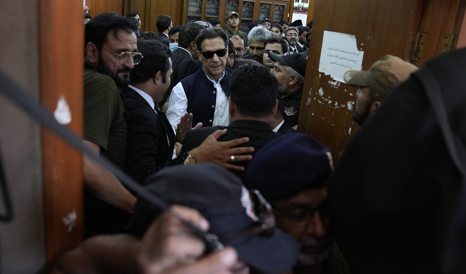Pakistan's former Prime Minister Imran Khan, center, leaves after appearing in a court, in Lahore, Pakistan on June 7, 2023. (AP)