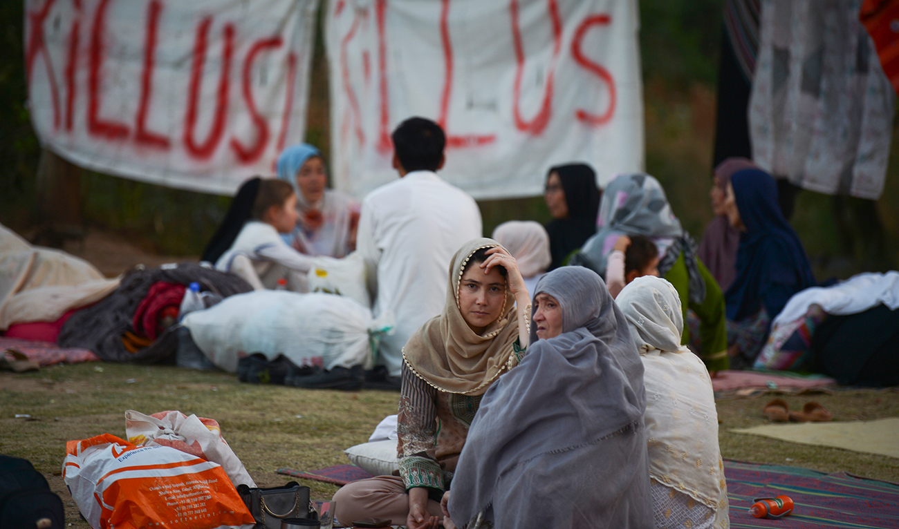 Afghan refugees seeking asylum abroad gather at an open field in protest to demand help from the United Nations High Commissioner for Refugees (UNHCR), in Islamabad on May 7, 2022. (AFP/File)