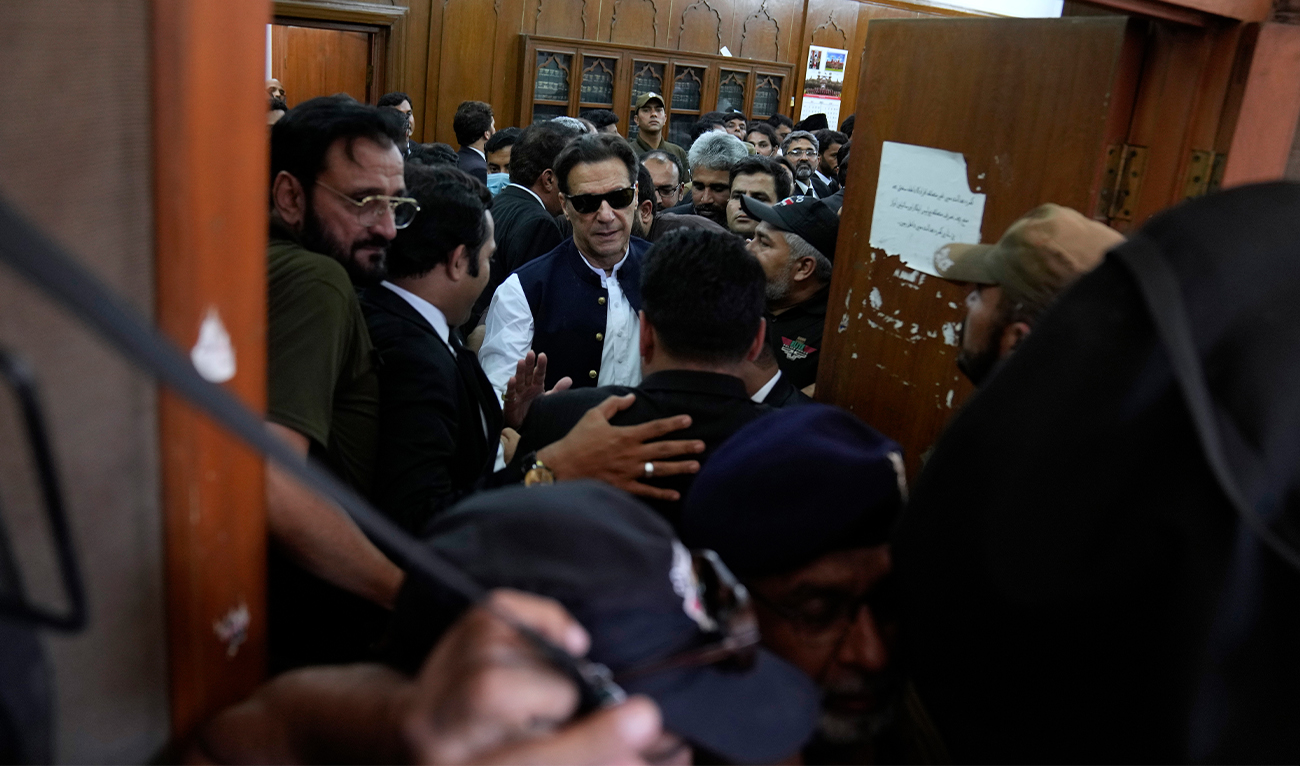 Pakistan's former Prime Minister Imran Khan, center, leaves after appearing in a court, in Lahore, Pakistan, on June 7, 2023. (AP/File)