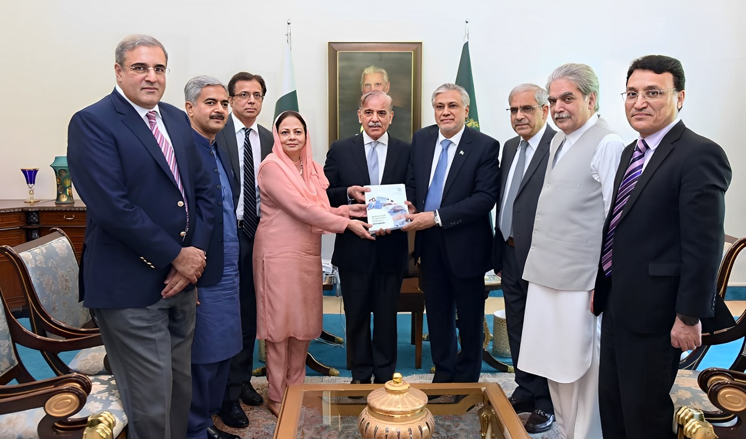 Pakistan Finance Minister Ishaq Dar, 4th right, and the economic team presenting Economic Survey of Pakistan for FY-2022-23 to Prime Minister Shehbaz Sharif, center, in Islamabad on June 8, 2023. (PID)