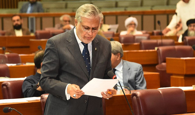 In this handout photograph, taken on April 13, 2023, Pakistan Finance Minister Ishaq Dar gestures during his address at the National Assembly in Islamabad. (Photo courtesy: Twitter/NAofPakistan)