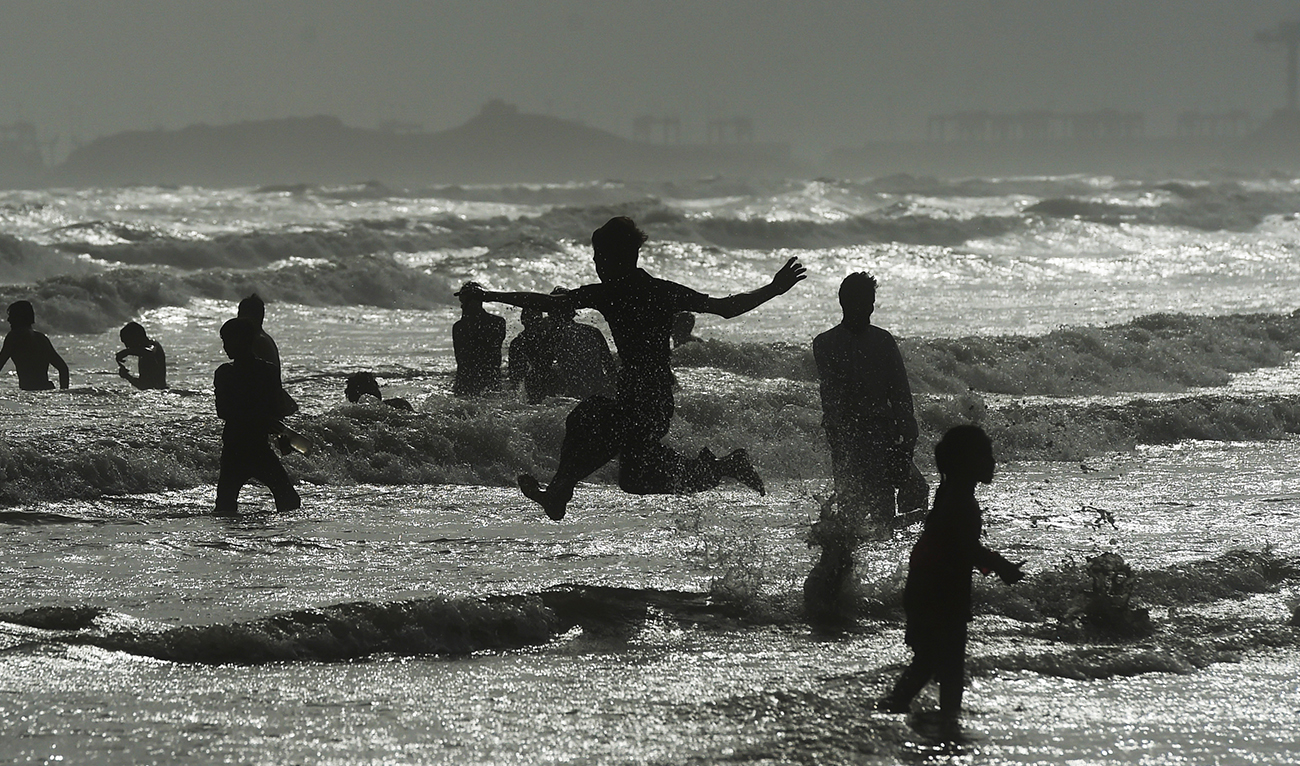 People cool off in the Arabian sea during a hot summer day in Karachi on July 2, 2021. (AFP/File)