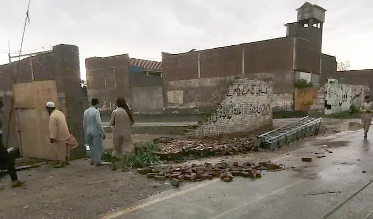 Residents look debris of a collapsed house in a hailstorm following heavy rains in the Bannu division in Khyber Pakhtunkhwa province on June 10, 2023. (Photo courtesy: Rescue 1122)