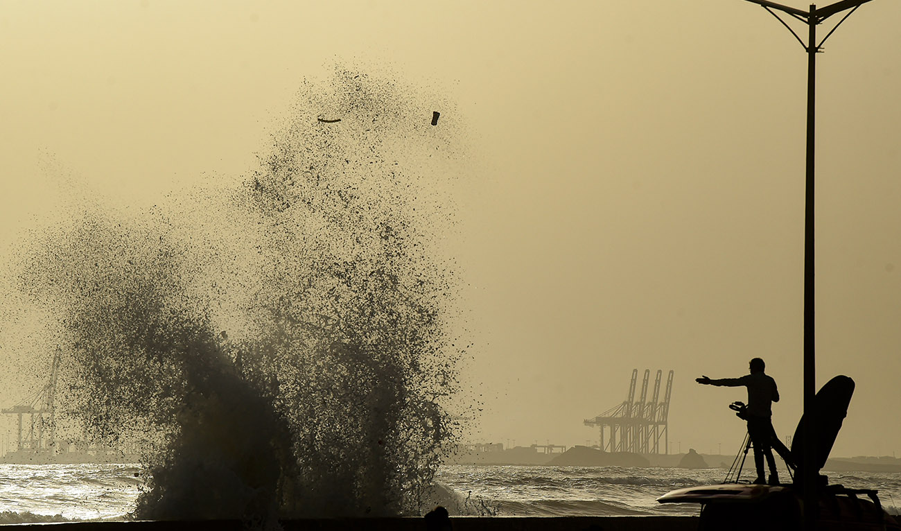 A news cameraman captures high tides at a beach before the due onset of cyclone, in Karachi on June 12, 2023. (AFP/File)