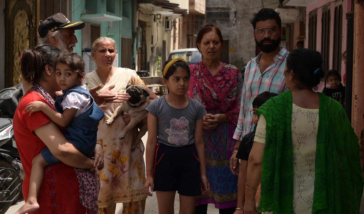 Residents gather along a street outside their homes after a magnitude 5.4 earthquake that struck eastern Kashmir was felt in Amritsar, India, on June 13, 2023. (AFP)