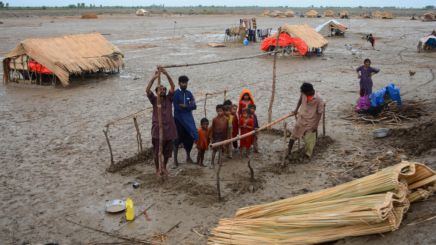 Cyclone afftected people built a hut at coastal area in Sujawal district of Pakistan's Sindh province on June 16, 2023, after Cyclone Biparjoy made landfall. (AFP)