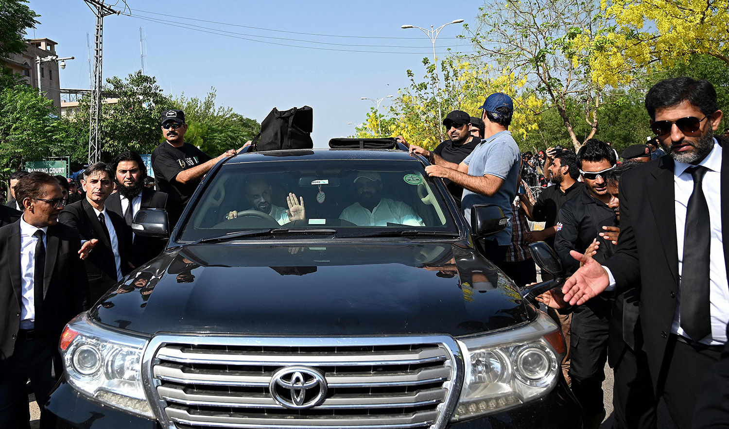 A vehicle carrying Pakistan's former Prime Minister Imran Khan leaves, after he appeared before the court in Islamabad, Pakistan on June 19, 2023. (AFP)