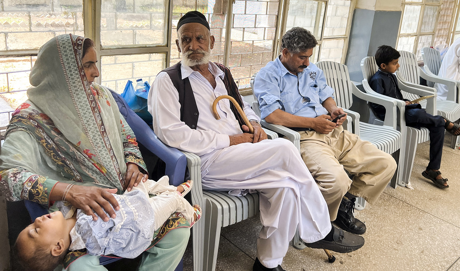 Family members of the victims, who are missing, along with others, after a migrant boat sunk off the coast of Greece, sit for their DNA sampling, at the district hospital in Khuiratta in Pakistan-administered Kashmir, June 20, 2023. (REUTERS)