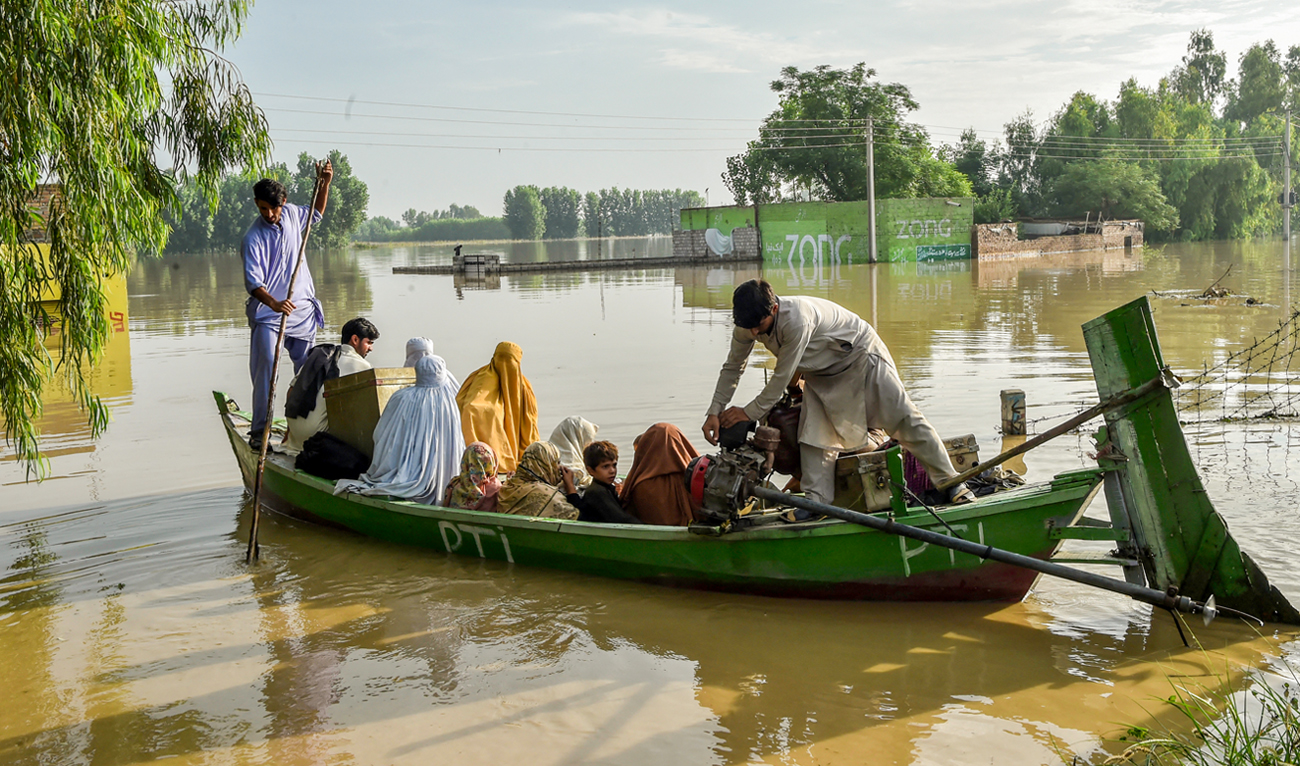 Stranded people are evacuated from flood affected areas after heavy monsoon rains in Charsadda district in the Khyber Pakhtunkhwa province of Pakistan on August 27, 2022. (AFP)