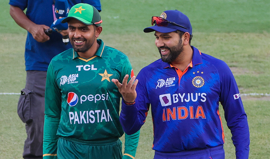 India's captain Rohit Sharma (R) and Pakistan's captain Babar Azam arrive for the toss before start of the Asia Cup Twenty20 international cricket Group A match at the Dubai International Cricket Stadium on August 28, 2022. (AFP/File)