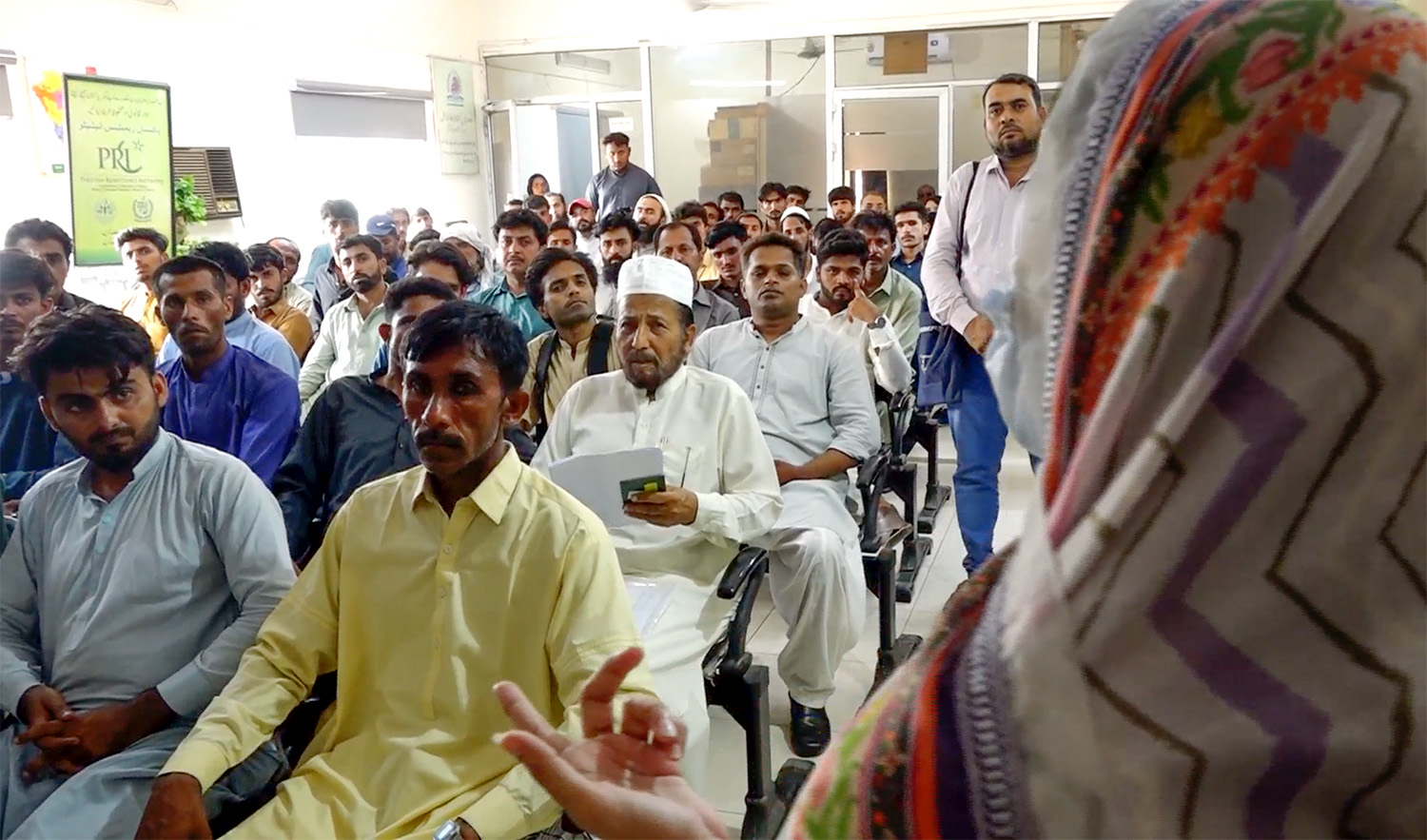 Pakistanis seeking employment overseas sit at the Bureau of Emigration & Overseas Employment in Karachi, Pakistan, on June 22, 2023. (AN Photo)