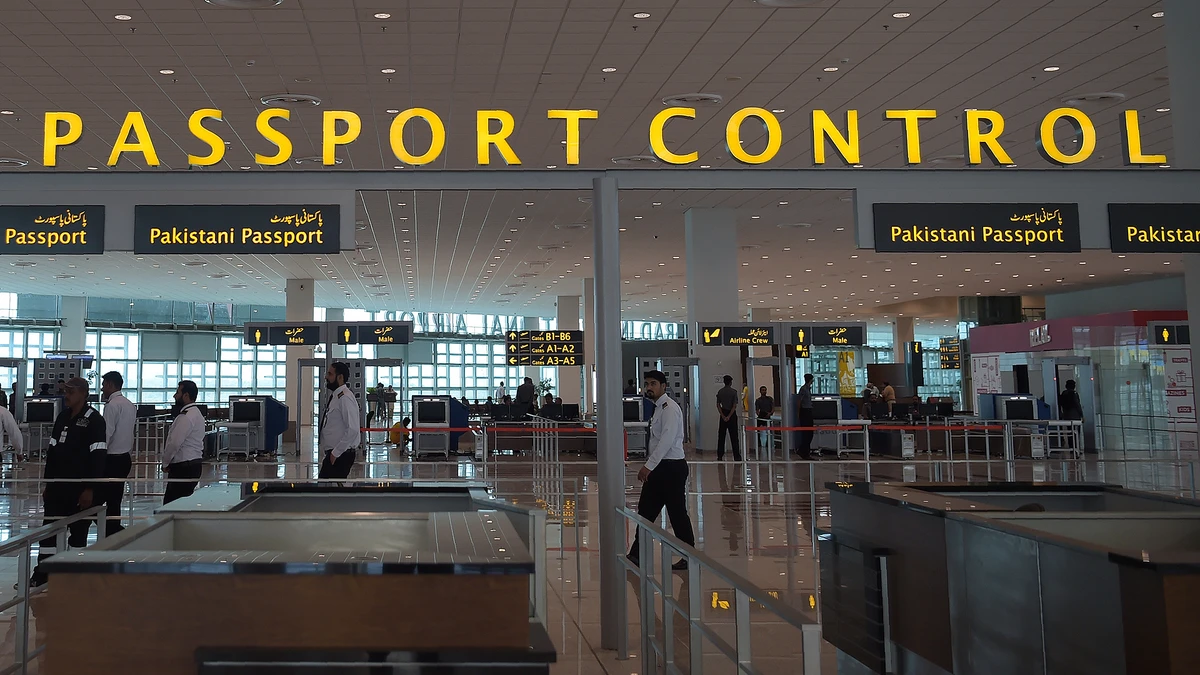 In this photograph taken on April 26, 2018, Pakistani airport staff walks through the Islamabad International Airport on the outskirts of Islamabad. (Photo courtesy: AFP/File)