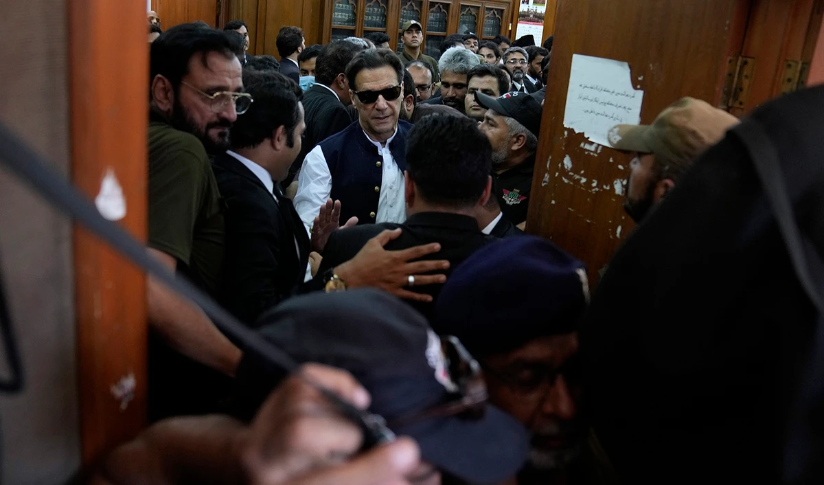 Pakistan's former Prime Minister Imran Khan, center, leaves after appearing in a court, in Lahore, Pakistan on June 7, 2023. (AP)