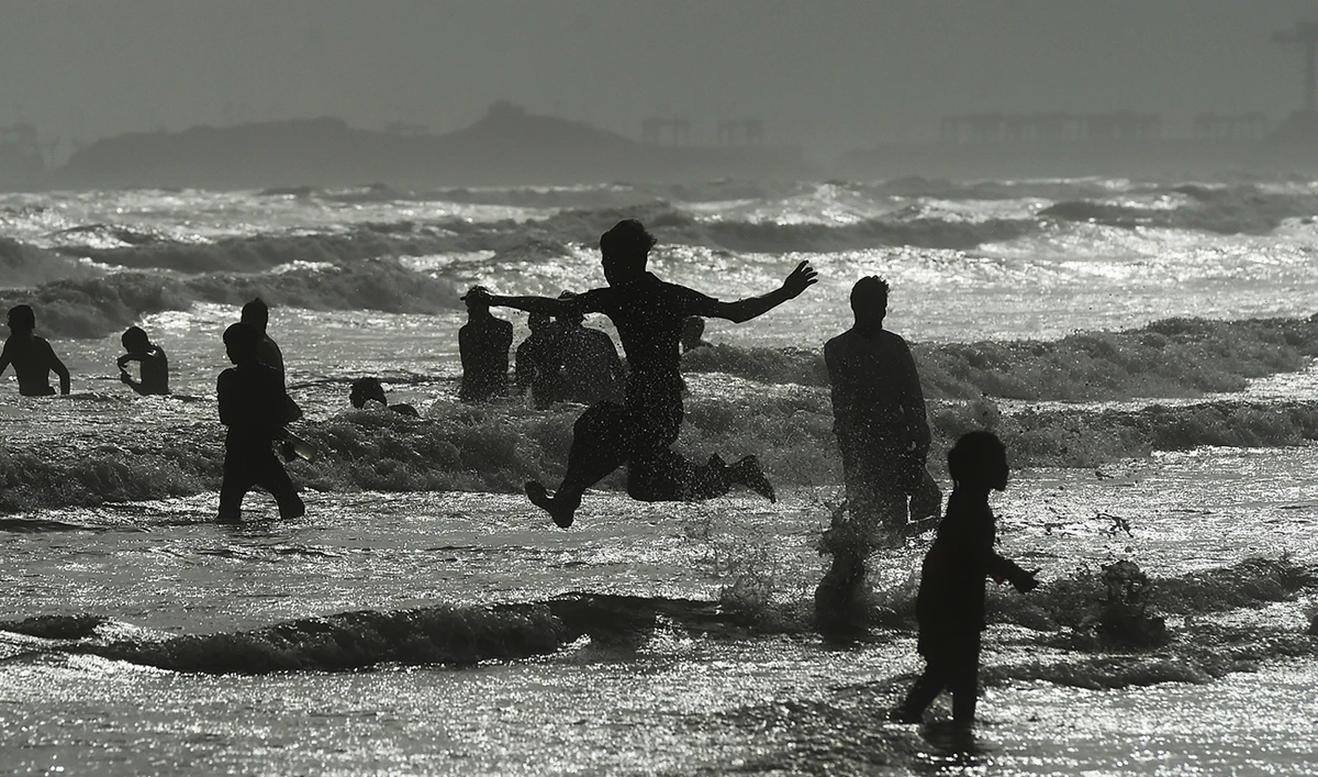 People cool off in the Arabian sea during a hot summer day in Karachi on July 2, 2021. (AFP/File)