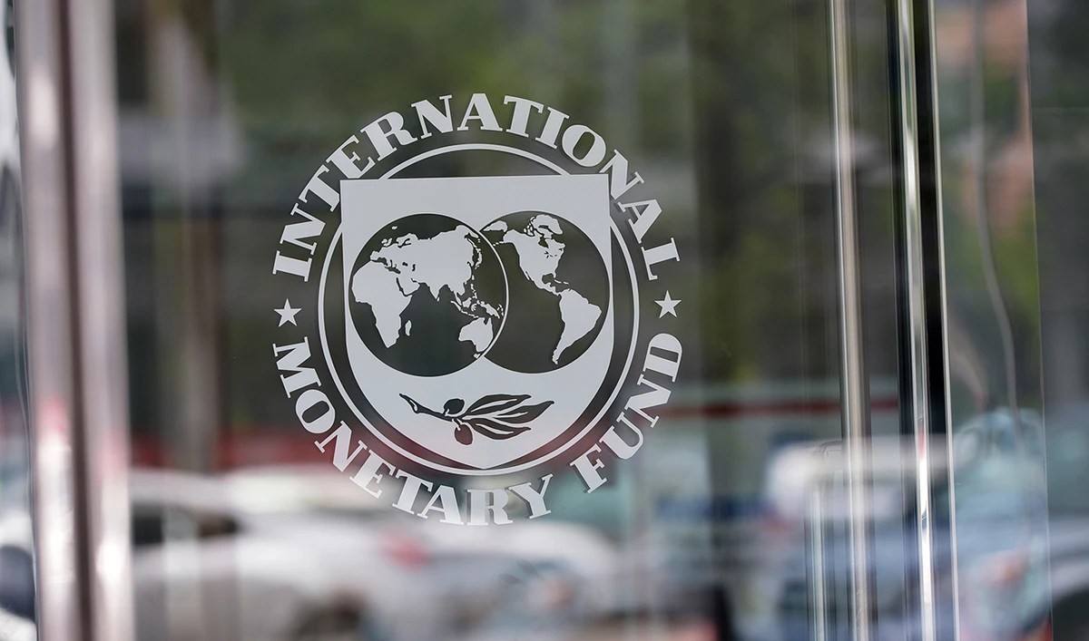 The seal of the International Monetary Fund is seen at the headquarters building in Washington, DC on July 5, 2015. (AFP/File)