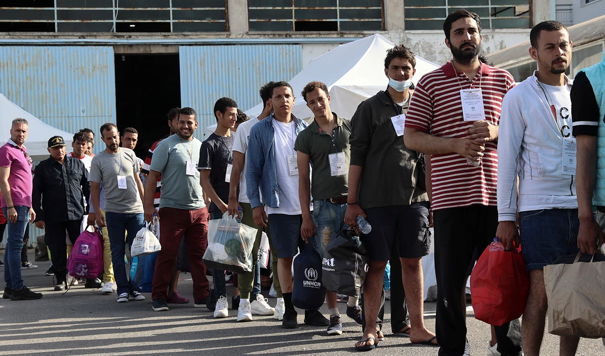 Survivors of latest tragical shipwreck prepare to board a bus to transfer to Athens at the port of Kalamata, Greece, on June 16, 2023. (InTime News via AP)