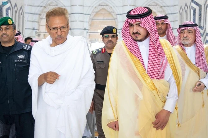 Deputy governor of the Makkah region Prince Badr bin Sultan bin Abdulaziz (right) receives Pakistan President Dr. Arif Alvi (left) as he arrives in Jeddah on June 25, 2023 ahead of the annual Hajj pilgrimage. (Saudi Press Agency)